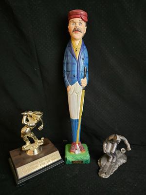 Golfing and skiing figures - tall wooden golfer - golfing trp[hy - and a pewter skier