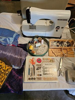 Vintage NECHI Sewing machine with sewing items and fabric