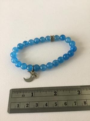 CFC. Marked blue beaded stretchy charm bracelet