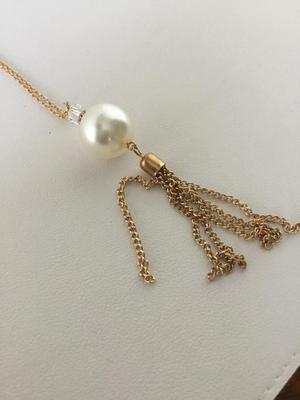 Gold tone faux pearl long necklace