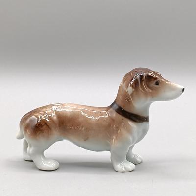 LOT 4: Hagen Renaker Dachshund Pup Lenk H1569, WhittleWare Wooden Dachshund, Occupied Japan Porcelain Dogs & More