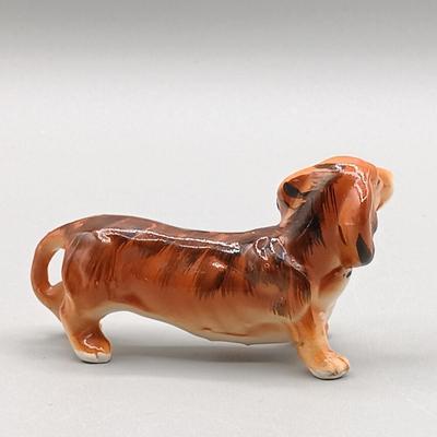 LOT 4: Hagen Renaker Dachshund Pup Lenk H1569, WhittleWare Wooden Dachshund, Occupied Japan Porcelain Dogs & More