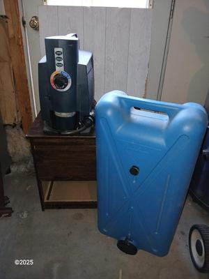 Coleman Hot Water On Demand Portable Water Heater with portable tote-along ten-gallon water tank