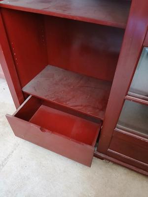 Red sliding glass door display cabinet with adjustable Shelves and drawer storage