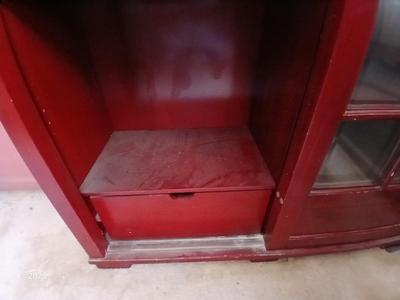 Red sliding glass door display cabinet with adjustable Shelves and drawer storage