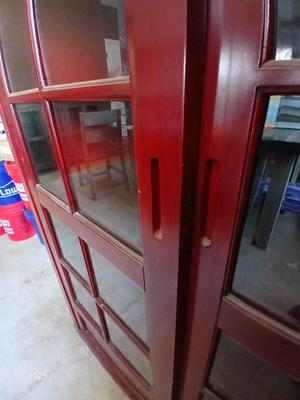 Red sliding glass door display cabinet with adjustable Shelves and drawer storage