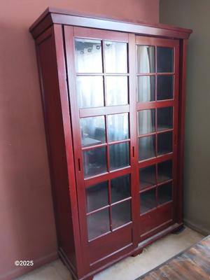 Red sliding glass door display cabinet with adjustable Shelves and drawer storage