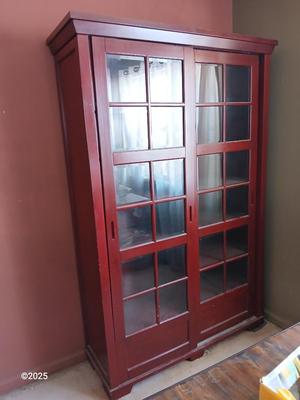 Red sliding glass door display cabinet with adjustable Shelves and drawer storage