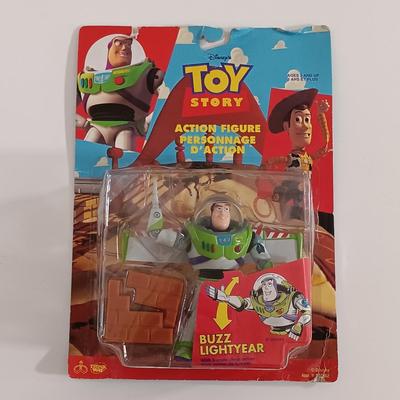 LOT 160B: Dick Tracy Sticker-Poster Set and Playmates Figures w/ 1981 Yoda Puppet, Pebbles Cereal Flintstones Toy & More