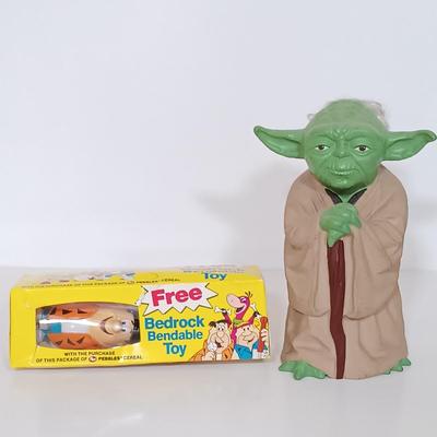LOT 160B: Dick Tracy Sticker-Poster Set and Playmates Figures w/ 1981 Yoda Puppet, Pebbles Cereal Flintstones Toy & More