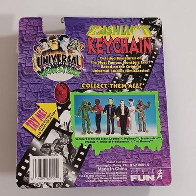 LOT 165B: Numbered Photos from Creature from the Black Lagoon and Frankenstein Meets the Wolf Man w/ Wolfman Keychain & American...