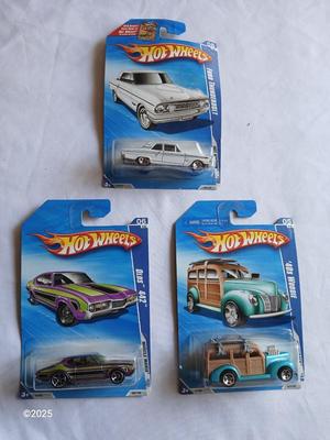 Three new Collectable hot wheels cars