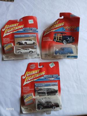 Three Johnny Lightning collectable cars