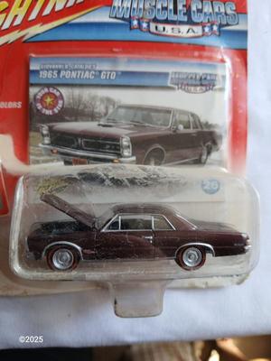 Three Johnny Lightning collectable cars