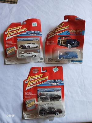 Three Johnny Lightning collectable cars