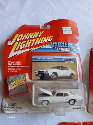 Three Johnny Lightning collectable cars