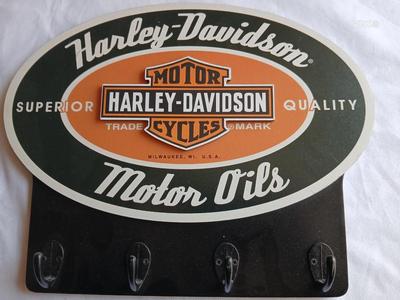 Tin Harley Realities ride and Rally sign Fort Collins, Co. with wooden Harley Davidson motor oils sign with hooks