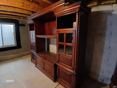 Adjustable wall unit entertainment center