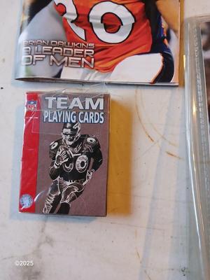 Broncos sports watch - ticket stubs - Gameday magazine - and team playing cards