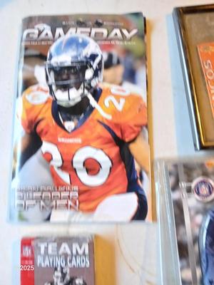 Broncos sports watch - ticket stubs - Gameday magazine - and team playing cards