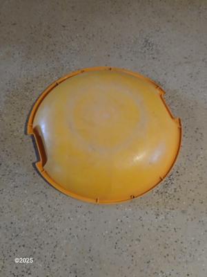 Two sleds - orange disk sled and a Snow boogie board