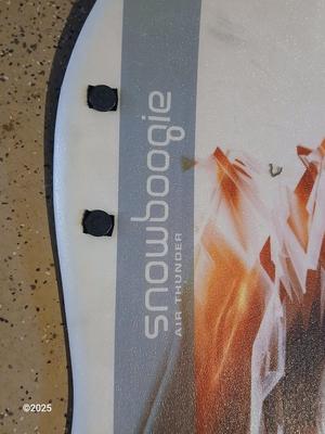 Two sleds - orange disk sled and a Snow boogie board