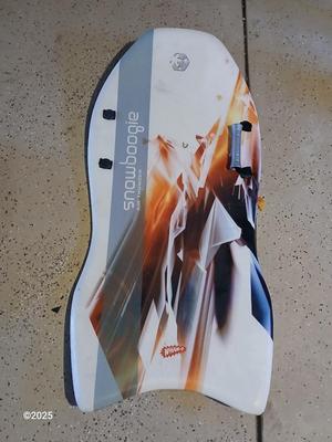 Two sleds - orange disk sled and a Snow boogie board