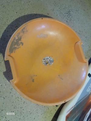 Two sleds - orange disk sled and a Snow boogie board