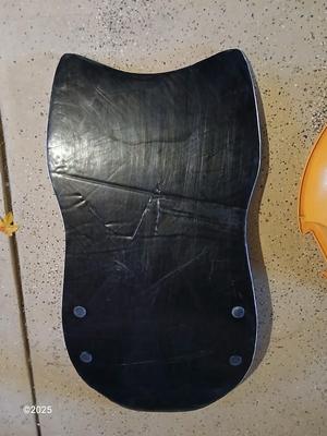 Two sleds - orange disk sled and a Snow boogie board
