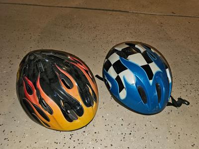 Two Child sized Bike helmets - Hot wheels & PTI
