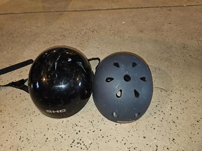 Two skate boarding helmets