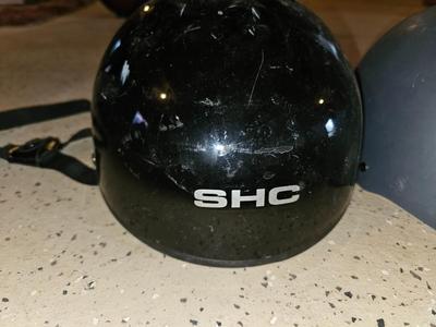 Two skate boarding helmets