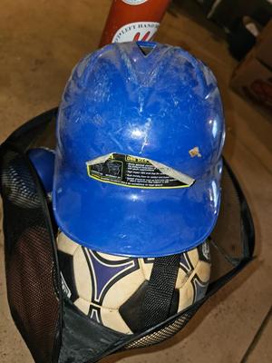 Net bag of sports balls - and a helmet