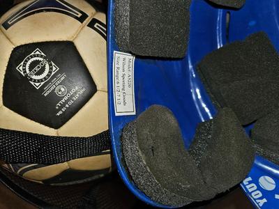Net bag of sports balls - and a helmet
