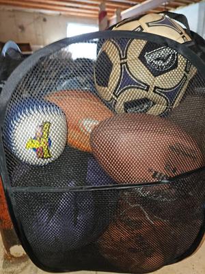 Net bag of sports balls - and a helmet