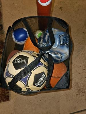 Net bag of sports balls - and a helmet