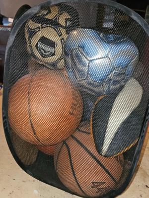 Net bag of sports balls - and a helmet