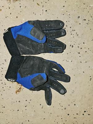 Sports bag with child's size rollerblades - Safety gear - and a few small golf clubs