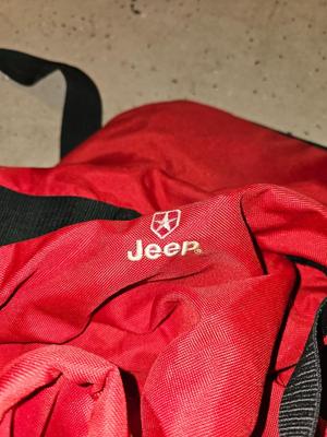 Sports bag with child's size rollerblades - Safety gear - and a few small golf clubs