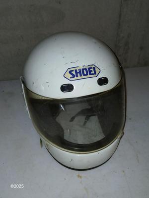 Two older dirt Bike helmets -