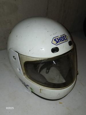 Two older dirt Bike helmets -