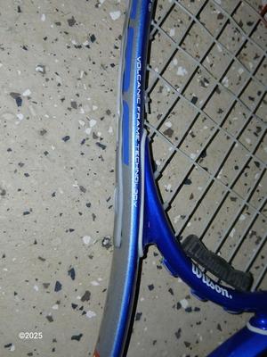 Three tennis racquets with a Wilson tennis racquet bag