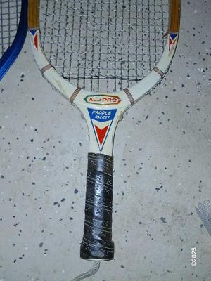 Racquets, paddles with pong balls and a small set of Pool balls