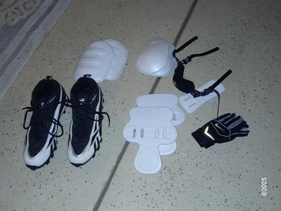 A nice pair of NFL size 9 cleats pads and Nike gloves