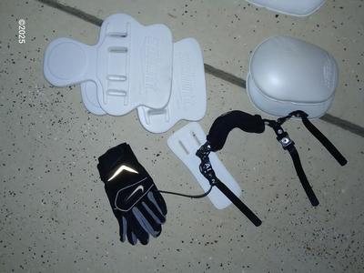 A nice pair of NFL size 9 cleats pads and Nike gloves