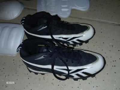A nice pair of NFL size 9 cleats pads and Nike gloves