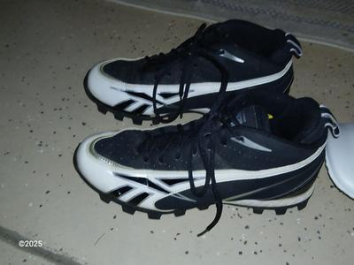 A nice pair of NFL size 9 cleats pads and Nike gloves