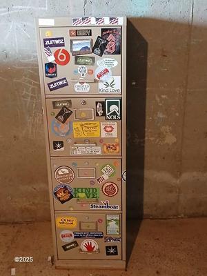 Metal filing cabinet - full of such cool local stickers