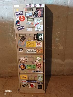 Metal filing cabinet - full of such cool local stickers