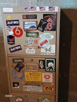 Metal filing cabinet - full of such cool local stickers
